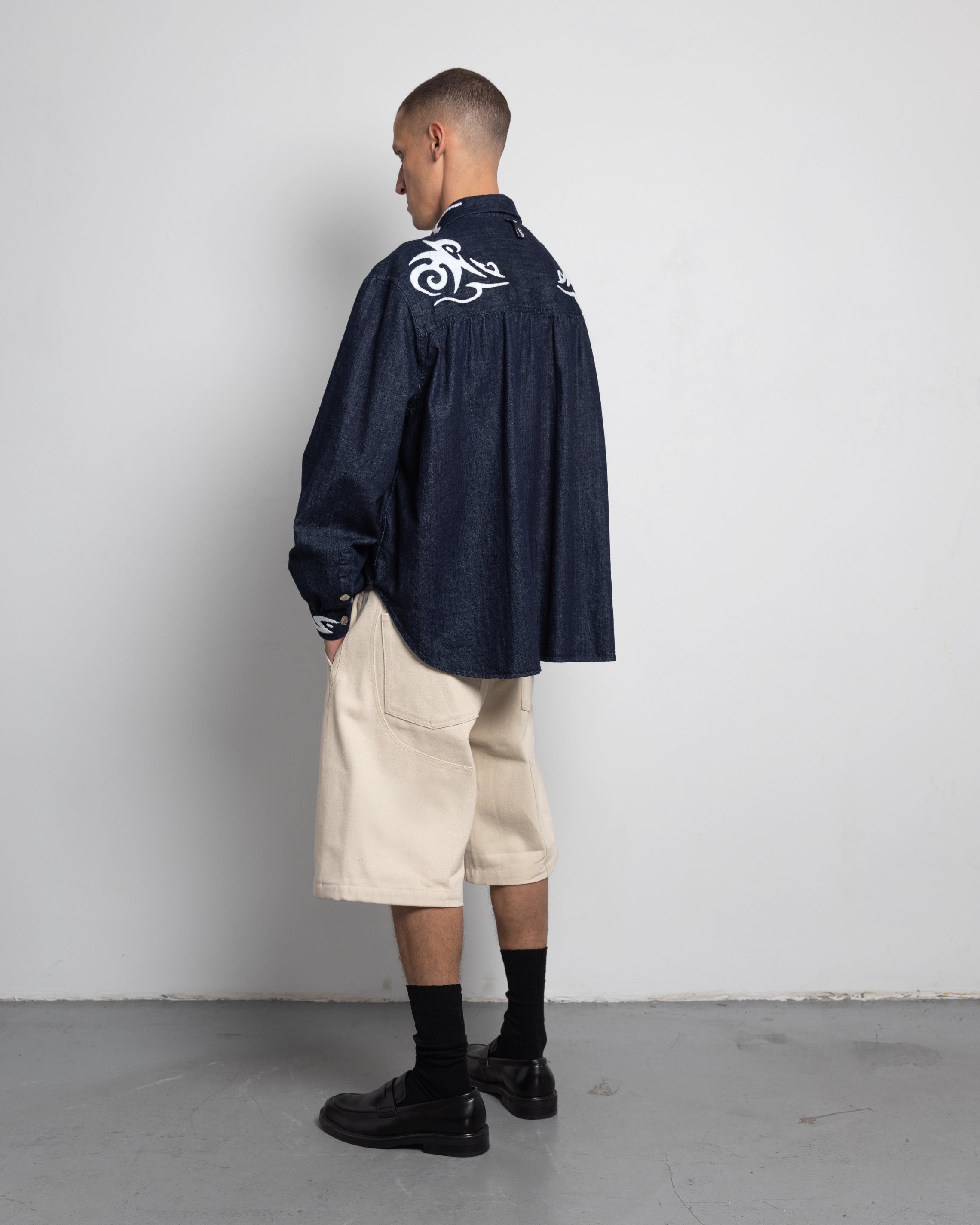 THE SHORT WORK CHAPS IN OFF-WHITE DENIM