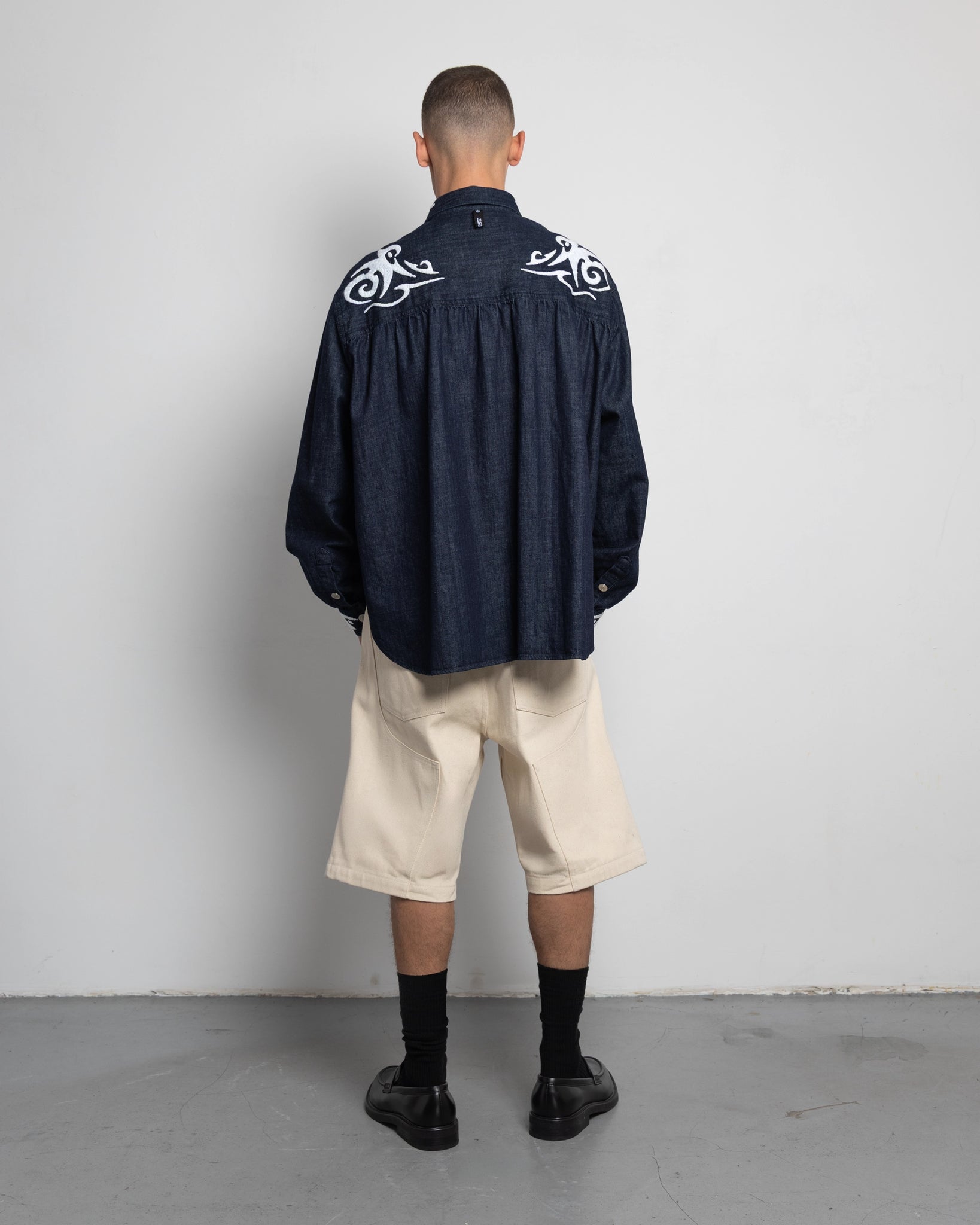 THE SHORT WORK CHAPS IN OFF-WHITE DENIM