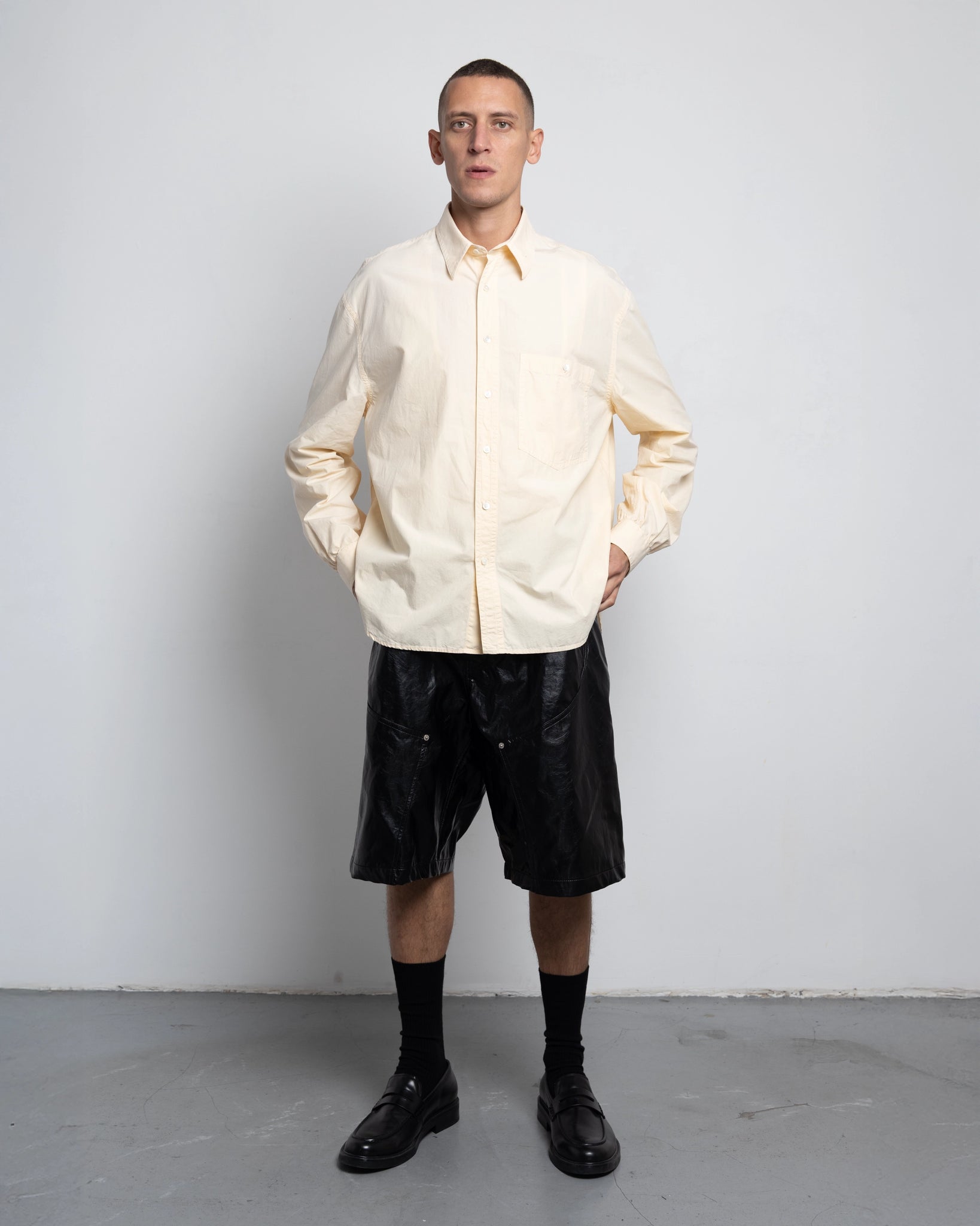 THE SHORT WORK CHAPS IN BLACK FAUX LEATHER