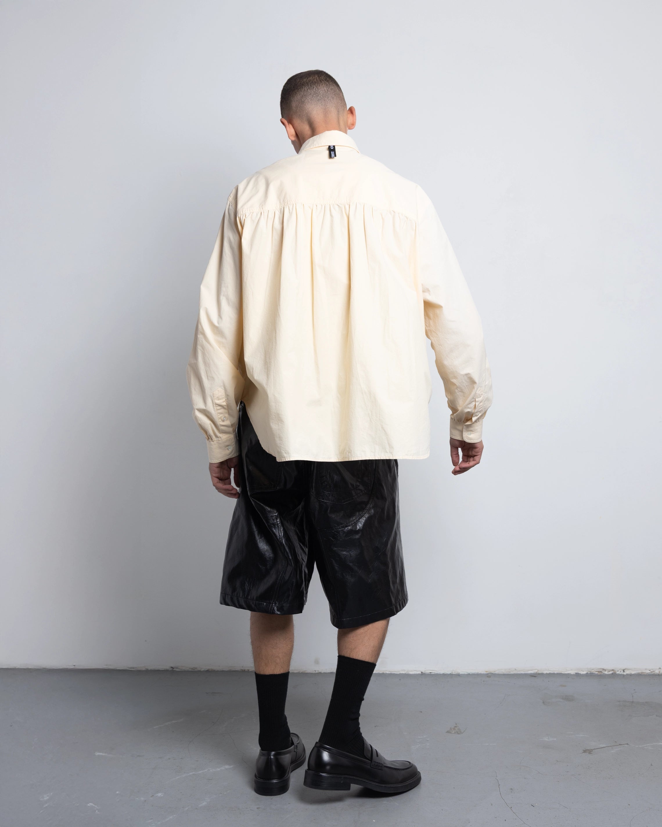 THE SHORT WORK CHAPS IN BLACK FAUX LEATHER
