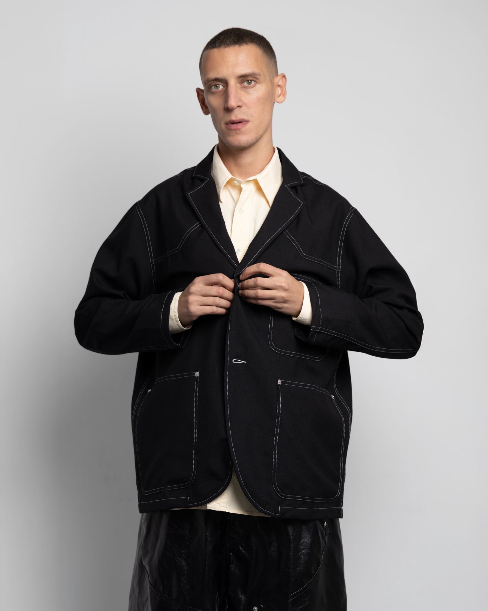 THE UNLINED JACKET IN BLACK WOOL CANVAS