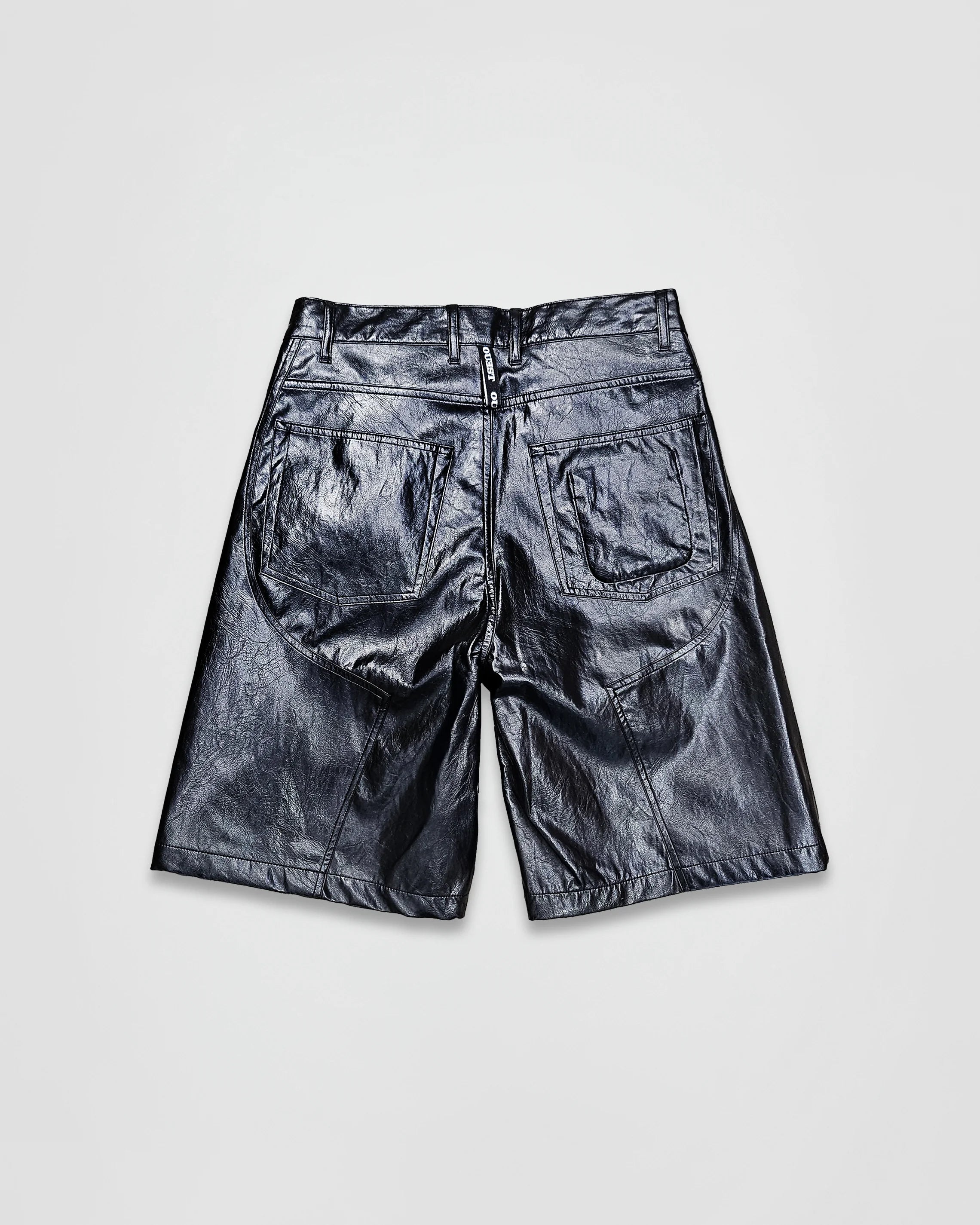 THE SHORT WORK CHAPS IN BLACK FAUX LEATHER