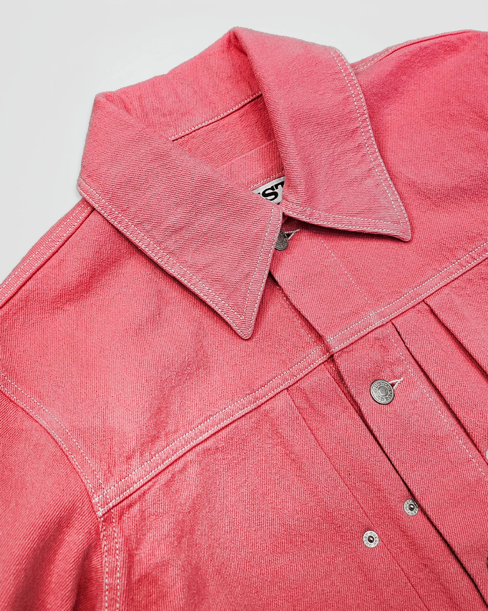 THE TRUCKER JACKET IN PINK DENIM