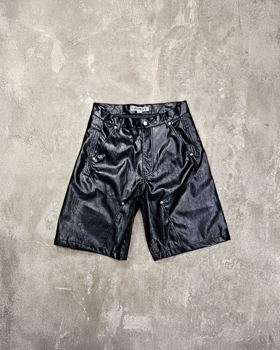 THE SHORT WORK CHAPS IN BLACK FAUX LEATHER
