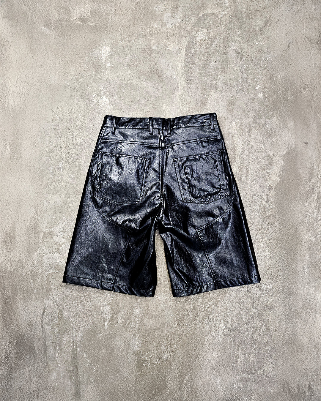 THE SHORT WORK CHAPS IN BLACK FAUX LEATHER