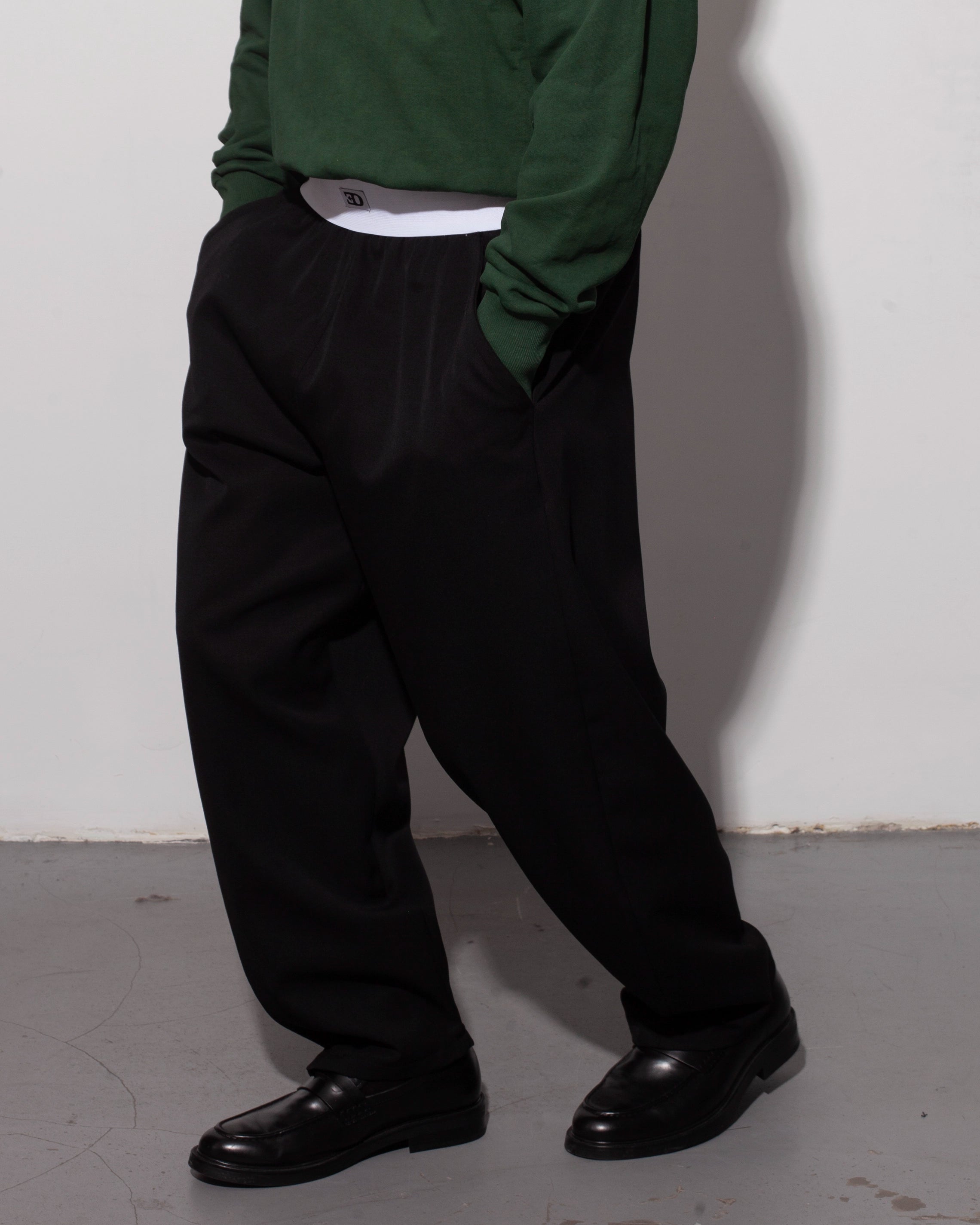THE BRIEF TROUSERS IN BLACK WOOL