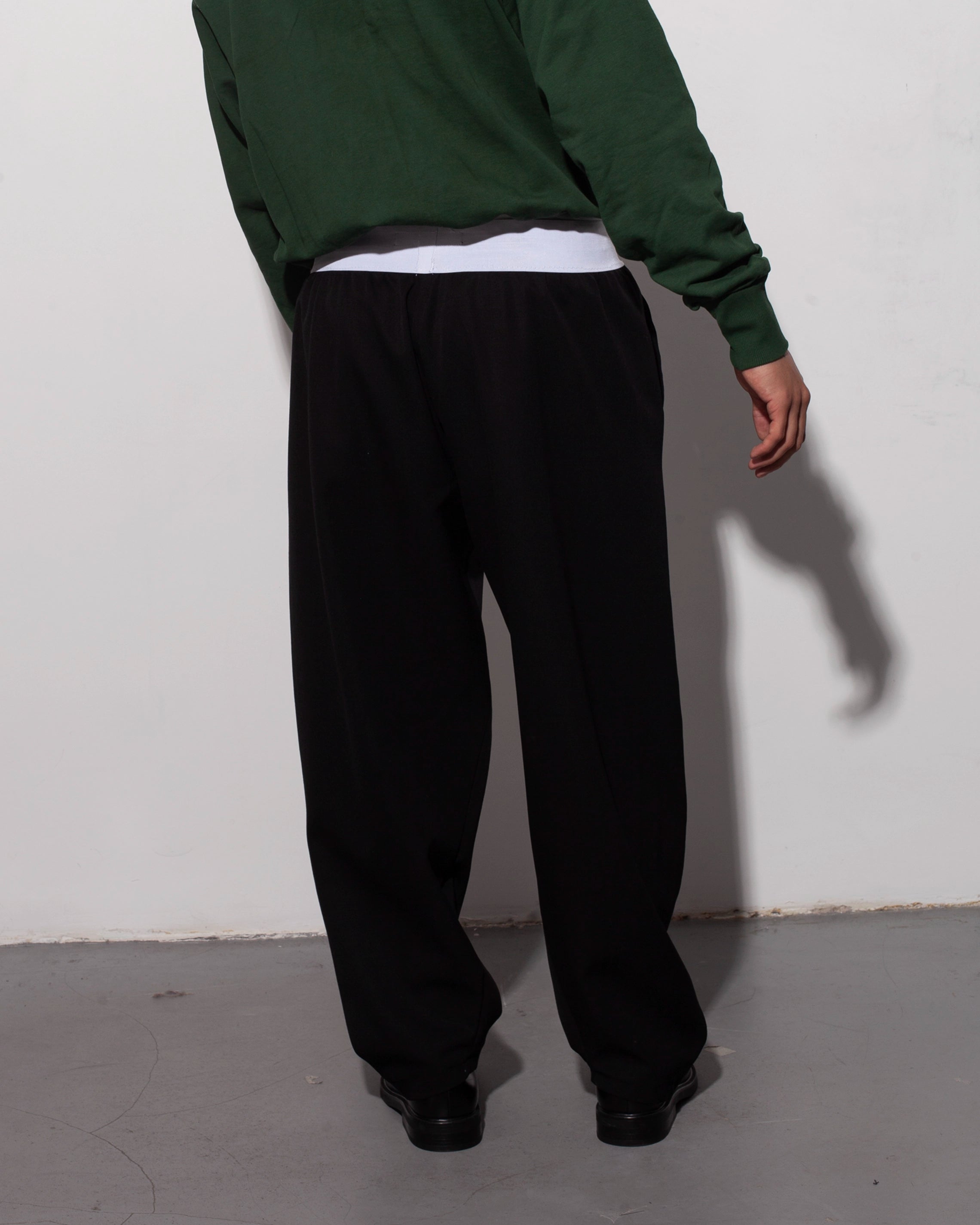 THE BRIEF TROUSERS IN BLACK WOOL